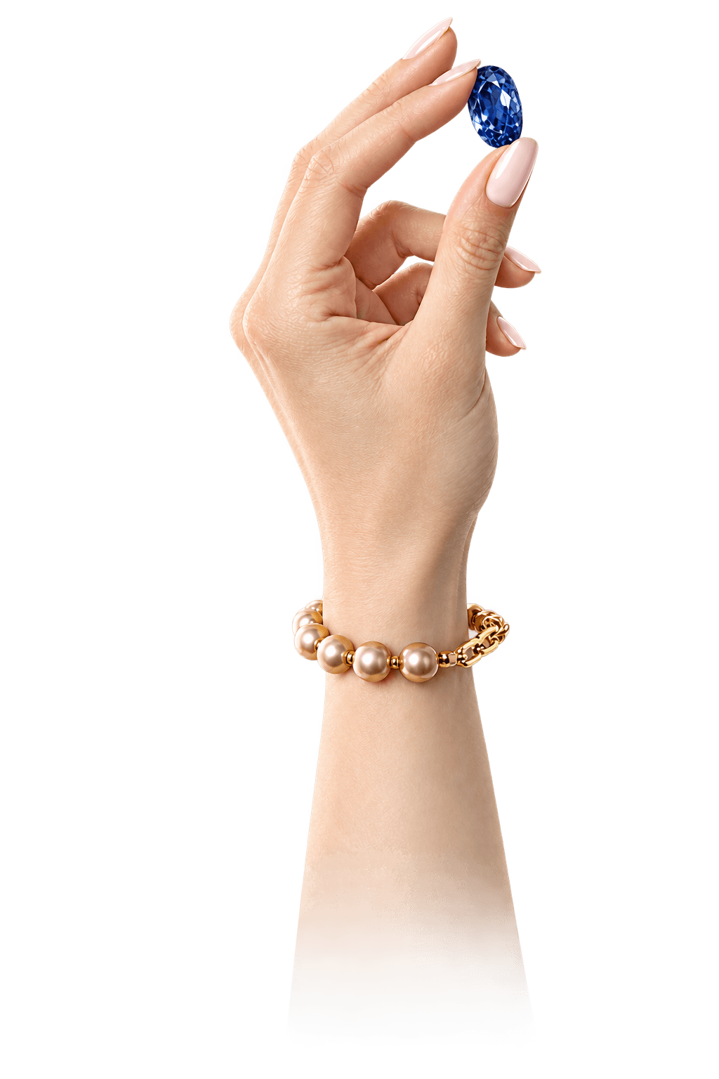 Hand holding a natural sapphire gemstone